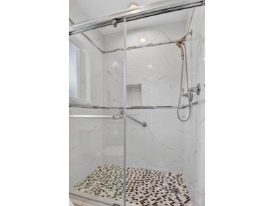 THIS COMPLETELY REMODELED VILLA HAS WIDE OPEN VIEWS OF THE 15TH on Delray Dunes Golf and Country Club in Florida - for sale on GolfHomes.com, golf home, golf lot