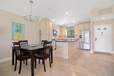 Spectacular turnkey 2BR/2BA Club Cottage with serene canal views on PGA National Golf Club in Florida - for sale on GolfHomes.com, golf home, golf lot