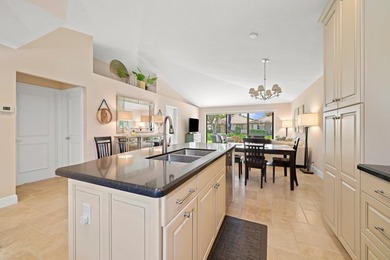 Spectacular turnkey 2BR/2BA Club Cottage with serene canal views on PGA National Golf Club in Florida - for sale on GolfHomes.com, golf home, golf lot