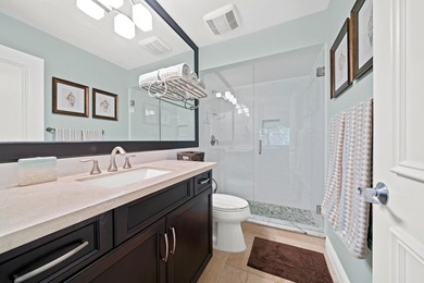 Spectacular turnkey 2BR/2BA Club Cottage with serene canal views on PGA National Golf Club in Florida - for sale on GolfHomes.com, golf home, golf lot