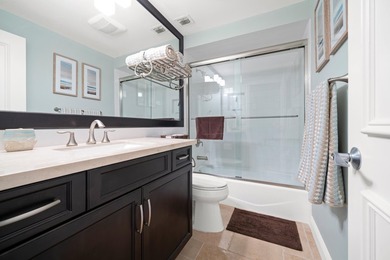 Spectacular turnkey 2BR/2BA Club Cottage with serene canal views on PGA National Golf Club in Florida - for sale on GolfHomes.com, golf home, golf lot