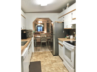 Meticulously maintained home in the much sought after Spanish on Spanish Lakes I in Florida - for sale on GolfHomes.com, golf home, golf lot