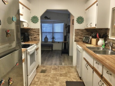 Meticulously maintained home in the much sought after Spanish on Spanish Lakes I in Florida - for sale on GolfHomes.com, golf home, golf lot