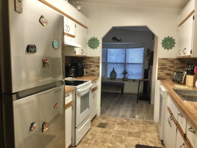 Meticulously maintained home in the much sought after Spanish on Spanish Lakes I in Florida - for sale on GolfHomes.com, golf home, golf lot