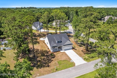 Nestled in the heart of the Shallotte Point area, this home on Rivers Edge Golf Club in North Carolina - for sale on GolfHomes.com, golf home, golf lot