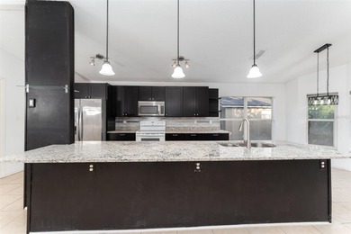 Welcome to the perfect Florida retreat where lush green fairways on Oakwood Golf Club in Florida - for sale on GolfHomes.com, golf home, golf lot