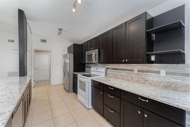 Welcome to the perfect Florida retreat where lush green fairways on Oakwood Golf Club in Florida - for sale on GolfHomes.com, golf home, golf lot