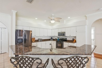 Under contract-accepting backup offers. This stunning on Hunters Green Country Club in Florida - for sale on GolfHomes.com, golf home, golf lot