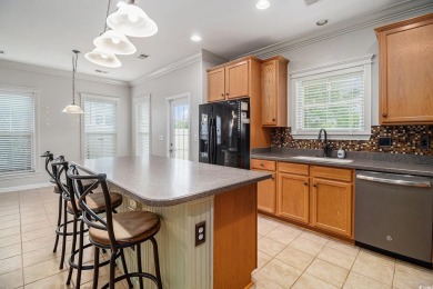Set on a desirable corner lot, this spacious 4-bedroom, 3-bath on Myrtle Beach National Golf Course in South Carolina - for sale on GolfHomes.com, golf home, golf lot