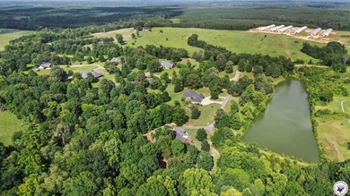 Tucked away on 3 private acres along the golf course, this on De Queen Country Club and Lodge in Arkansas - for sale on GolfHomes.com, golf home, golf lot