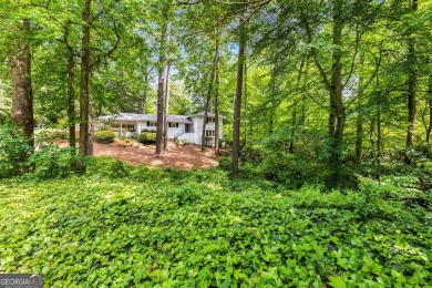 Nestled on a large 3/4+ acre serene, corner lot in the highly on Bobby Jones Golf Club in Georgia - for sale on GolfHomes.com, golf home, golf lot