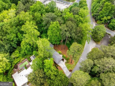 Nestled on a large 3/4+ acre serene, corner lot in the highly on Bobby Jones Golf Club in Georgia - for sale on GolfHomes.com, golf home, golf lot