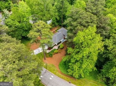 Nestled on a large 3/4+ acre serene, corner lot in the highly on Bobby Jones Golf Club in Georgia - for sale on GolfHomes.com, golf home, golf lot
