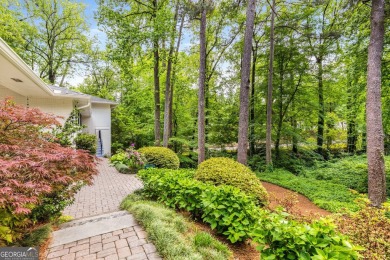Nestled on a large 3/4+ acre serene, corner lot in the highly on Bobby Jones Golf Club in Georgia - for sale on GolfHomes.com, golf home, golf lot