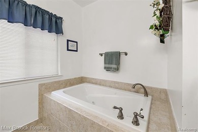 Welcome home to this charming detached colonial-style condo in on The Maples Club in Michigan - for sale on GolfHomes.com, golf home, golf lot