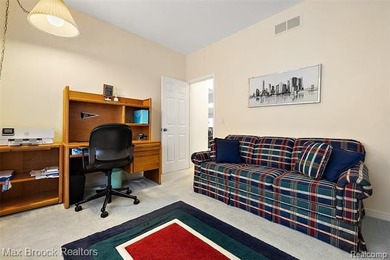 Welcome home to this charming detached colonial-style condo in on The Maples Club in Michigan - for sale on GolfHomes.com, golf home, golf lot