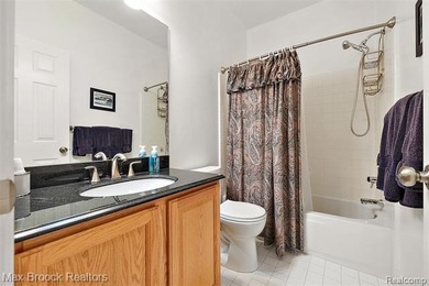 Welcome home to this charming detached colonial-style condo in on The Maples Club in Michigan - for sale on GolfHomes.com, golf home, golf lot