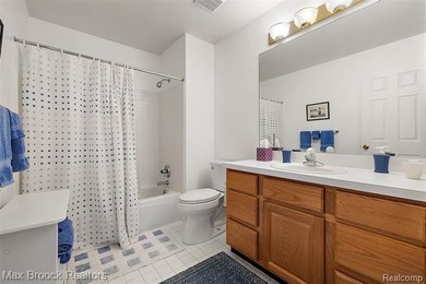 Welcome home to this charming detached colonial-style condo in on The Maples Club in Michigan - for sale on GolfHomes.com, golf home, golf lot