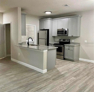 Beautiful remodeled ground floor apartment, with laminate on Southern Dunes Golf and Country Club in Florida - for sale on GolfHomes.com, golf home, golf lot