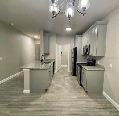 Beautiful remodeled ground floor apartment, with laminate on Southern Dunes Golf and Country Club in Florida - for sale on GolfHomes.com, golf home, golf lot