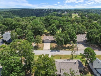 This beautifully updated home is on the 3rd green of a pristine on Holiday Island Golf Course in Arkansas - for sale on GolfHomes.com, golf home, golf lot