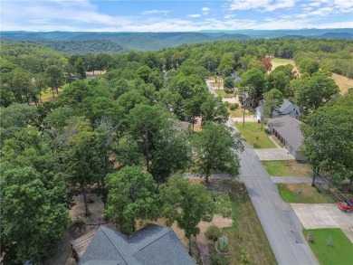 This beautifully updated home is on the 3rd green of a pristine on Holiday Island Golf Course in Arkansas - for sale on GolfHomes.com, golf home, golf lot