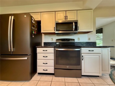 You'll truly have it *made in the shade* in this gorgeous condo on Falcon Watch Golf Club in Florida - for sale on GolfHomes.com, golf home, golf lot