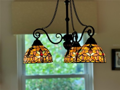 You'll truly have it *made in the shade* in this gorgeous condo on Falcon Watch Golf Club in Florida - for sale on GolfHomes.com, golf home, golf lot
