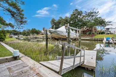 Sought after Davis Canal Front Property featuring boat lift on Founders Club At St. James Plantation in North Carolina - for sale on GolfHomes.com, golf home, golf lot