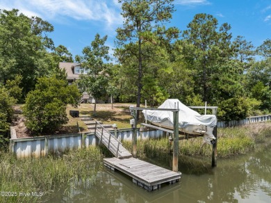 Sought after Davis Canal Front Property featuring boat lift on Founders Club At St. James Plantation in North Carolina - for sale on GolfHomes.com, golf home, golf lot
