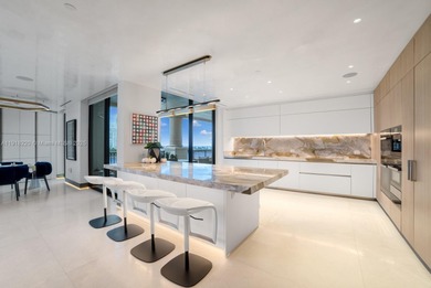 This elegantly designed 4-bedroom, 4.5-bath residence at Palazzo on Fisher Island Club in Florida - for sale on GolfHomes.com, golf home, golf lot