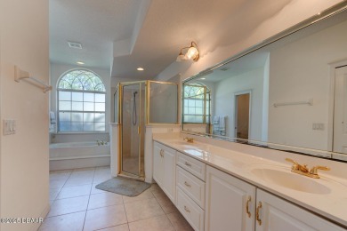 Spacious 3-bedroom, 2-bath home with a den located on the 7th on The Grand Club Cypress Course in Florida - for sale on GolfHomes.com, golf home, golf lot