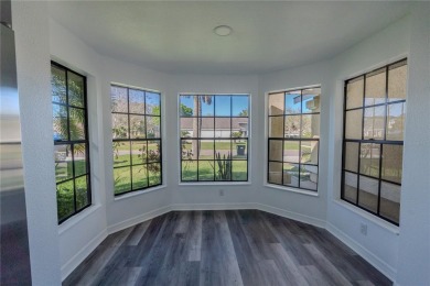 This lovely corner three-bedroom, two-bathroom home is in the on Eastwood Golf Club in Florida - for sale on GolfHomes.com, golf home, golf lot