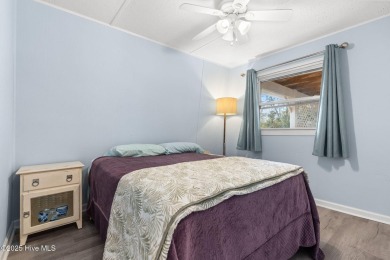 This charming residence is ideally located near the beach on Oyster Bay Golf Links in North Carolina - for sale on GolfHomes.com, golf home, golf lot