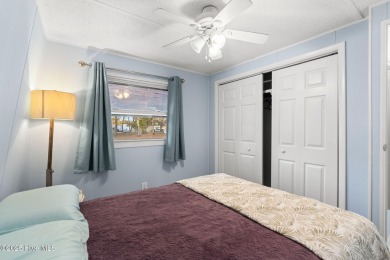 This charming residence is ideally located near the beach on Oyster Bay Golf Links in North Carolina - for sale on GolfHomes.com, golf home, golf lot