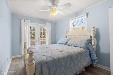 This charming residence is ideally located near the beach on Oyster Bay Golf Links in North Carolina - for sale on GolfHomes.com, golf home, golf lot