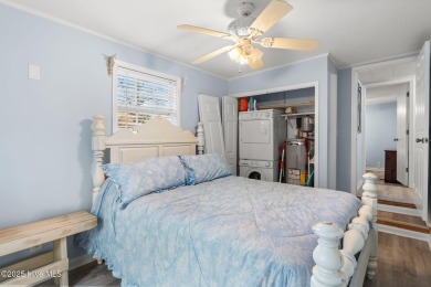 This charming residence is ideally located near the beach on Oyster Bay Golf Links in North Carolina - for sale on GolfHomes.com, golf home, golf lot