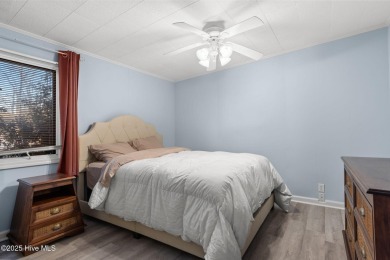 This charming residence is ideally located near the beach on Oyster Bay Golf Links in North Carolina - for sale on GolfHomes.com, golf home, golf lot