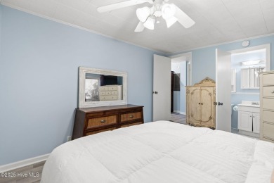 This charming residence is ideally located near the beach on Oyster Bay Golf Links in North Carolina - for sale on GolfHomes.com, golf home, golf lot
