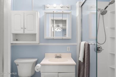 This charming residence is ideally located near the beach on Oyster Bay Golf Links in North Carolina - for sale on GolfHomes.com, golf home, golf lot