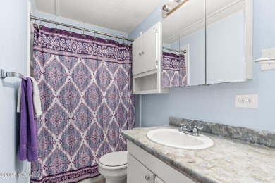 This charming residence is ideally located near the beach on Oyster Bay Golf Links in North Carolina - for sale on GolfHomes.com, golf home, golf lot