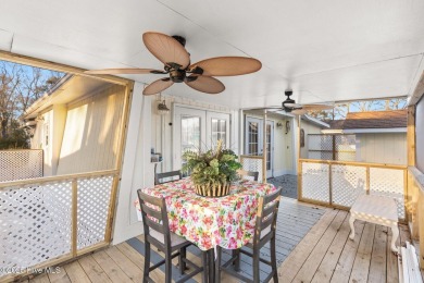 This charming residence is ideally located near the beach on Oyster Bay Golf Links in North Carolina - for sale on GolfHomes.com, golf home, golf lot