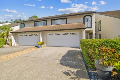 This townhouse is located on Meadow #1 of the Carrollwood on Carrollwood Country Club in Florida - for sale on GolfHomes.com, golf home, golf lot