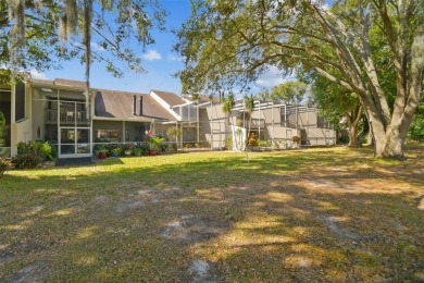 This townhouse is located on Meadow #1 of the Carrollwood on Carrollwood Country Club in Florida - for sale on GolfHomes.com, golf home, golf lot