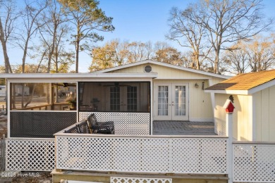 This charming residence is ideally located near the beach on Oyster Bay Golf Links in North Carolina - for sale on GolfHomes.com, golf home, golf lot