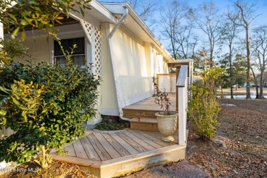 This charming residence is ideally located near the beach on Oyster Bay Golf Links in North Carolina - for sale on GolfHomes.com, golf home, golf lot