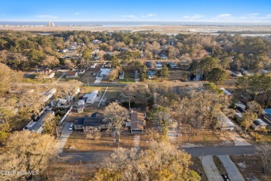 This charming residence is ideally located near the beach on Oyster Bay Golf Links in North Carolina - for sale on GolfHomes.com, golf home, golf lot