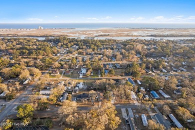This charming residence is ideally located near the beach on Oyster Bay Golf Links in North Carolina - for sale on GolfHomes.com, golf home, golf lot