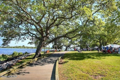 This charming residence is ideally located near the beach on Oyster Bay Golf Links in North Carolina - for sale on GolfHomes.com, golf home, golf lot