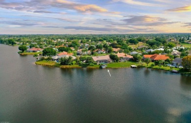 This incredible lakefront property is located in the gated on Greenview Cove Golf Club in Florida - for sale on GolfHomes.com, golf home, golf lot